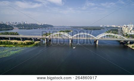 Aerial Top View Of Automobile And Railroad Darnitsky Bridge Across Dnieper River From Above, Kiev Ci
