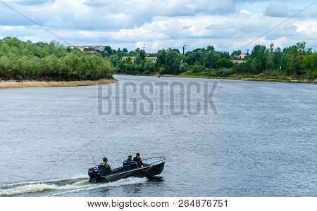 View Of The Pripyat River: Fishermen Go Fishing In A Motorboat