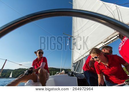POROS, GREECE - OCT 9, 2018: Sailors participate in sailing regatta 20th Ellada Autumn 2018 among Greek island group in the Aegean Sea, in Cyclades and Saronic Gulf.