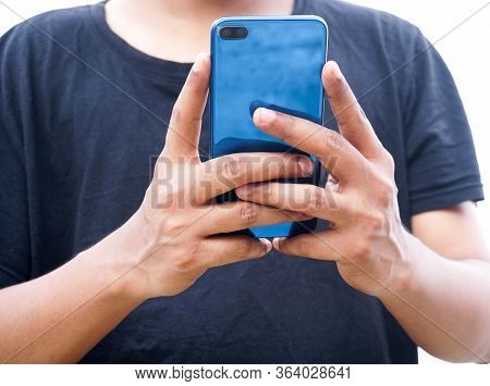 Young asian or  Indian man using smartphone