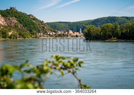 River Danube And Duernstein With The Kuenringer Castle And Blue And White Tower Of The Abbey Church 