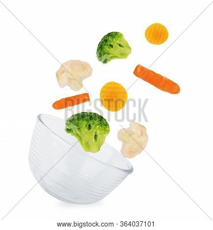 Glass Dish On A White Background, Isolated Pile Of Frozen Vegetables