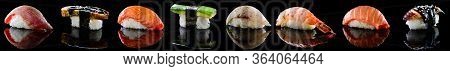 Set Of Traditional Japanese Nigiri Sushi Collection On Black With Reflection. Delicious Sashimi Seaf