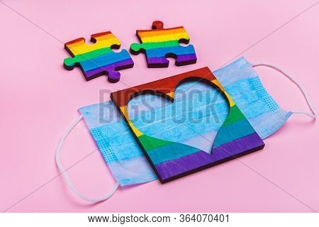 Lgbt Symbol Puzzles And Heart Frame Painted By A Rainbow On A Medical Mask. Coronavirus Quarantine, 