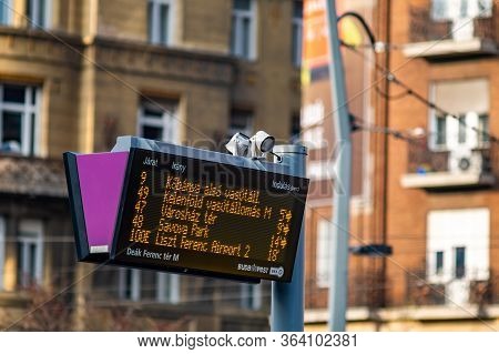 Budapest / Hungary - October 20, 2018: Digital Bus Stop Timetable Display Board Announcing Bus Sched