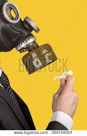 Close Up Portrait Of Man In A Protective Gas Mask With Flower