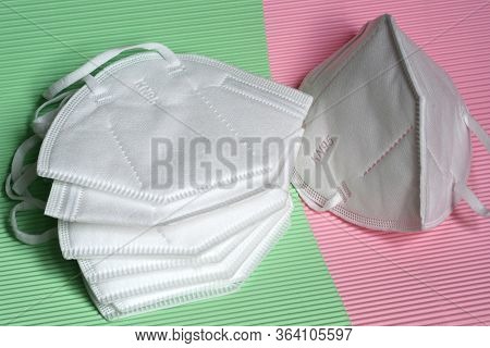 Closeup Of Antivirus Protection Masks Ffp2 Or Kn95 On Colored Background. Prevention For Coronavirus