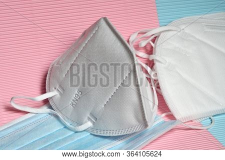 Detail of white KN95 or FFP2 mask with antiviral medical mask for protection against coronavirus on 
