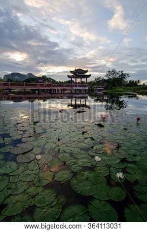 Melati Lake, Perlis, Malaysia Chinese Architechtural Bridge In Morning.