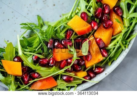 Bright Persimmon Arugula Pomegranate Seeds Salad