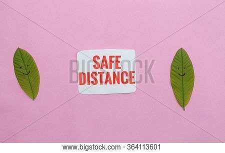 Social Distancing Or Safe Distance Due To Coronavirus Or Covid-19 Conceptual Photo With Leaves Made 