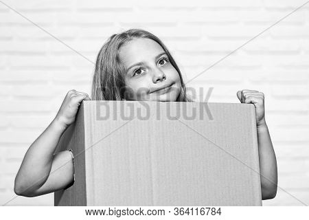 Make Moving Easier. Girl Small Child Carry Cardboard Box. Move Out Concept. Delivering Your Purchase