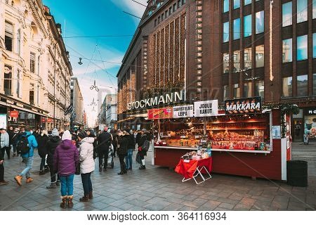Helsinki, Finland - December 10, 2016: People Walking On Christmas Xmas Market Near Stockmann Depart