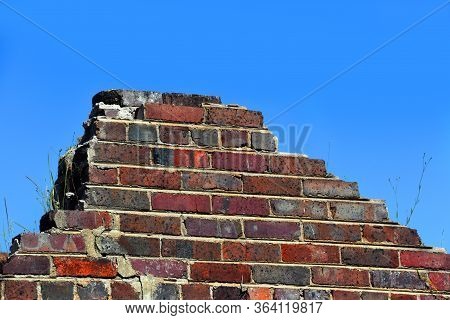 Background Image Shows A Stack Of Mortored Brick , A Portion Remaining From The Demolition Of An Old