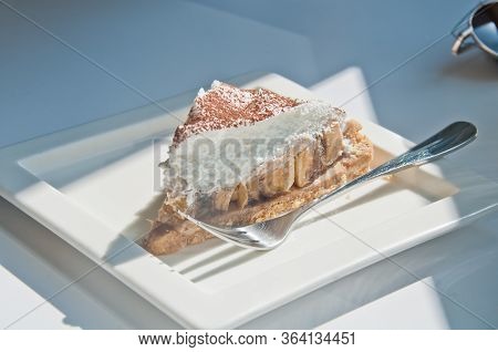 Delicious Yummy Light New York Cheese Cake In White Square Platre And Silver Spoon