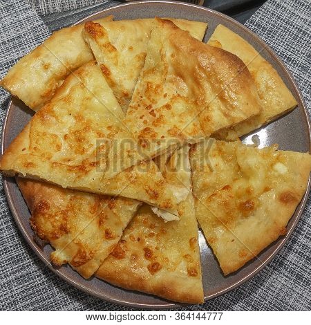 Georgian Dish - Megrelian Khachapuri. As A Filling, Young Imeritin Cheese Is Used. Top View. Nationa