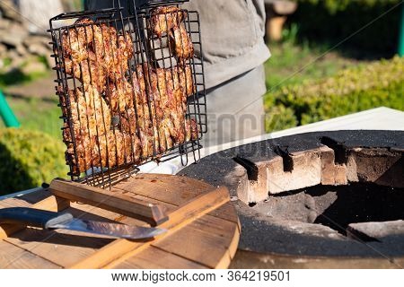 Meat Is Cooked Inside Aboveground Large Brick Tandir Oven In The Garden In A Country House