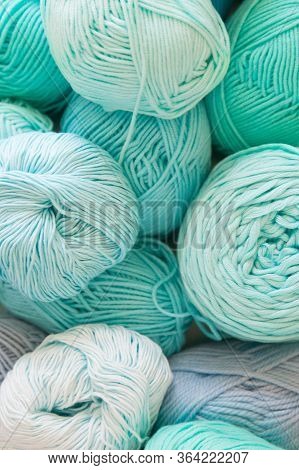 Colored Balls And Skiens Of Yarn. Top View. Aquamarine Colors. Yarn For Knitting.