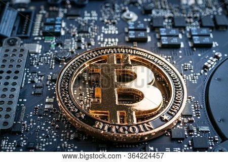 Cryptocurrency Background. Gold Bitcoin Computer Electronic Circuit Board Motherboard. Cryptocash Mi