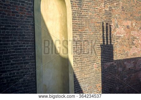 View Of The Red Brick Wall On Which The Shadow, Prague, Czech Republic