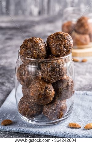 Energy Balls Of Dried Fruits And Nuts In A Glass Jar, Sellective Focus On Background.the Concept Of 