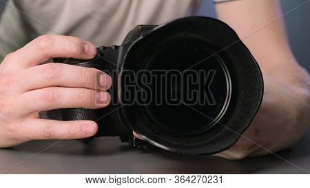 Hand Pressing The Shutter Button On The Camera
