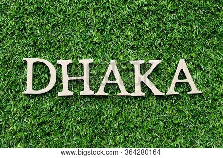 Wood Alphabet Letter In Word Dhaka On Green Grass Background