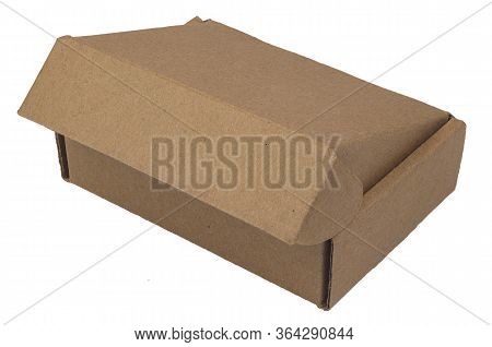 The Brown Cardboard Box For Packing Goods Is Ajar. Isolated Image On A White Background. Delivery, P
