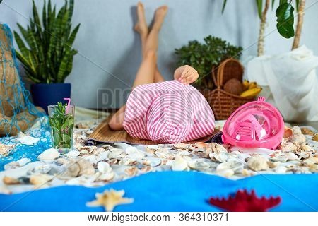 The Girls Is Lying On A Fictional Beach Near The Sea Or Ocean, Sunbathes.