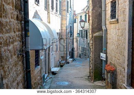 Winding Street Of The Authentic, Old Town Of Herceg Novi, Montenegro. We See Old Houses And Very Nar