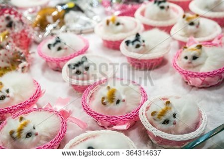 A Soft Focus Of Decorative Figurine Cats In A Basket Displayed In A Shop In Ci Qi Kou Old Town,  Cho