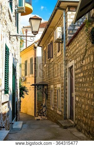 Winding Street Of The Authentic, Old Town Of Herceg Novi, Montenegro. We See Old Houses And Very Nar