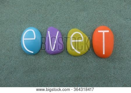 Evet, Yest In Turkish Language Composed With Multi Colored Stone Letters Over Green Sand
