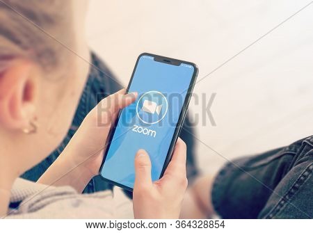 Kyiv, Ukraine-january, 2020: Zoom On Mobile Phone Screen. Young Girl Pointing Or Texting Smart Phone