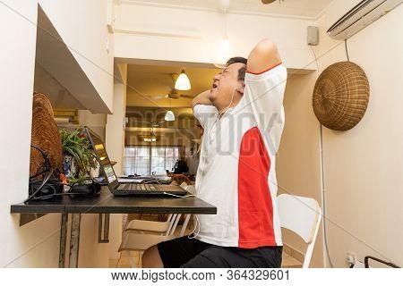 Matured Asian Business Man With Both Hands On Head In Stressful Expression In Work From Home Video C