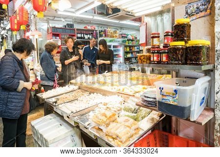 Hong Kong,march 24,2019:people Among The Classic Markets In The Narrow And Crowded Streets Of Hong K