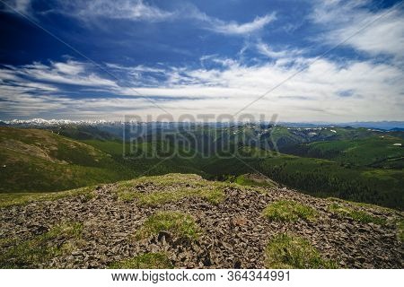 Spectacular View From The Top Of The Mountain To The Mountain Slopes And Meadows In The Ulagansky Di