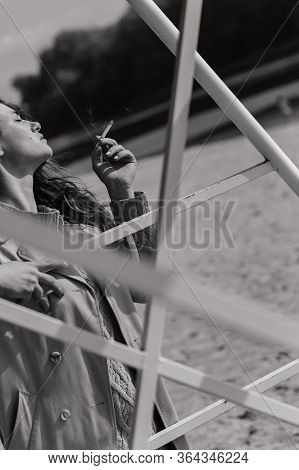 Woman With A Cigarette In Her Hands