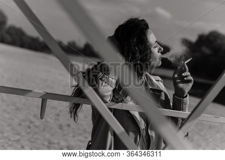 Smoking Woman With A Cigarette In Her Hands
