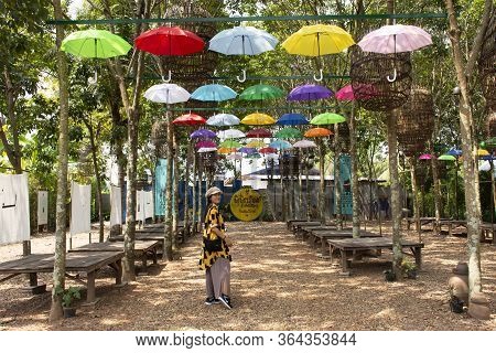 Travelers Thai Women Visit Travel And Take Photo With Colorful Umbrella Hanging On Tree Outdoor At G