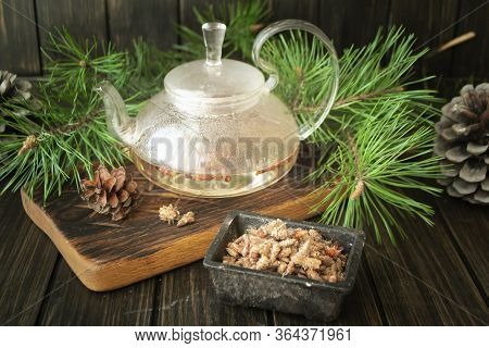 Medicinal Decoction With Pine Buds In Glass Teapot
