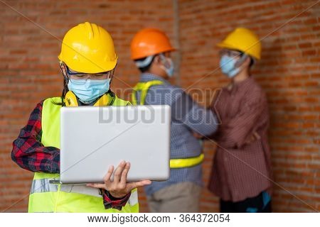Engineer Women Wear Protective Face Masks For Safety Corona Virus Disease 2019 (covid-19) Use Laptop