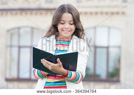 Book That Deserves To Be Read Happy Kid Read Book Outdoors. Small Child Learn To Read. Reading Day. 