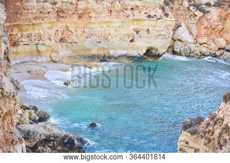 Small Empty Beach Between Cliffs. Uncrowded Travel Concept. Algarve, Portugal