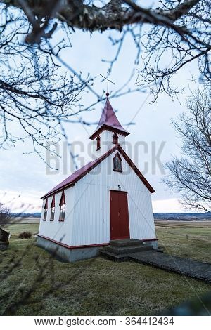 Typical Red Colored Wooden Church In Fludir Town In South Iceland Within The Golden Circle. Sunset L