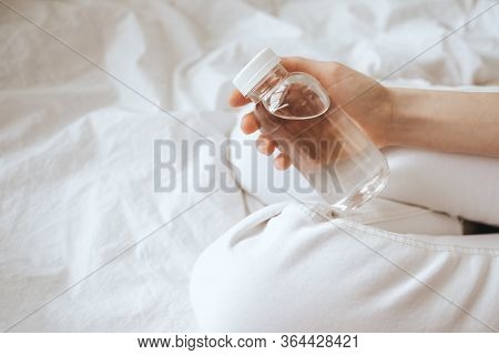 Transparent Bottle Made Of Eco-plastic With Drinking Water In Female Hands.