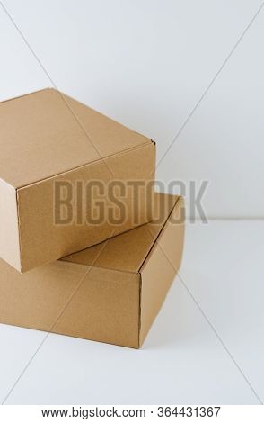 Different Size Cardboard Boxes On A White Background.