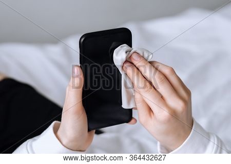 Cleaning The Smartphone Screen With A Fiber Cloth From Dirt Dust And Other External Factors. Mobile 