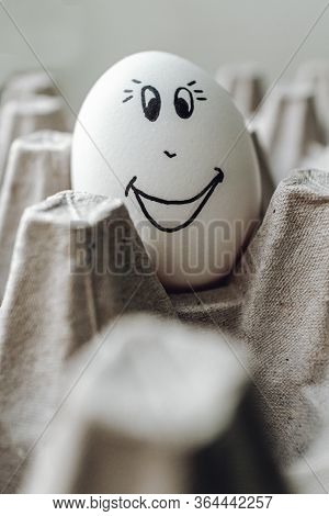 Masked White Egg On A Cardboard Stand. Emotions, Facial Expressions. Natural Protein. Healthy Diet F
