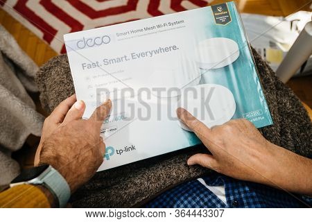 Paris, France - Circa 2020: Senior Hands Unboxing Unpacking New Parcel From Amazon Prime Containing 